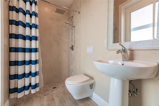 bathroom with toilet and walk in shower