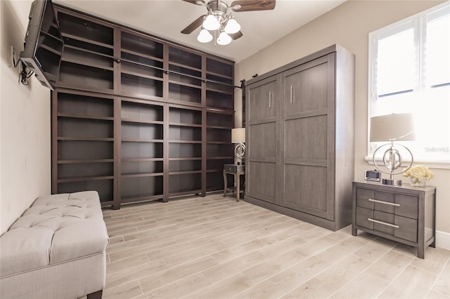 interior space with ceiling fan and light hardwood / wood-style flooring