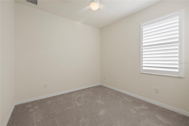 unfurnished room with carpet flooring and ceiling fan