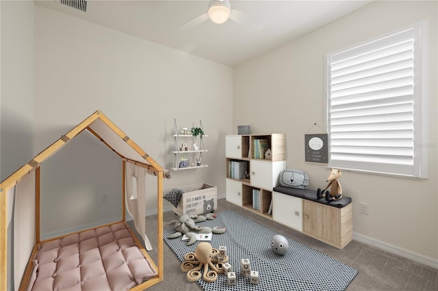 office area featuring light carpet and ceiling fan