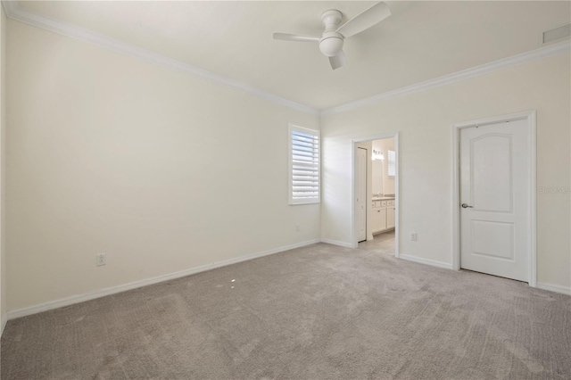 unfurnished bedroom with ensuite bathroom, crown molding, ceiling fan, and light colored carpet