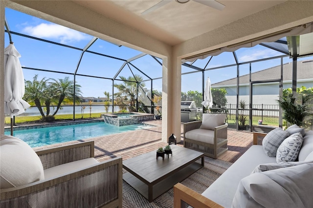 view of pool with outdoor lounge area, glass enclosure, a patio area, and a water view