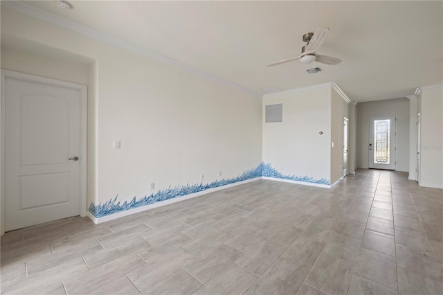 empty room with ceiling fan and ornamental molding