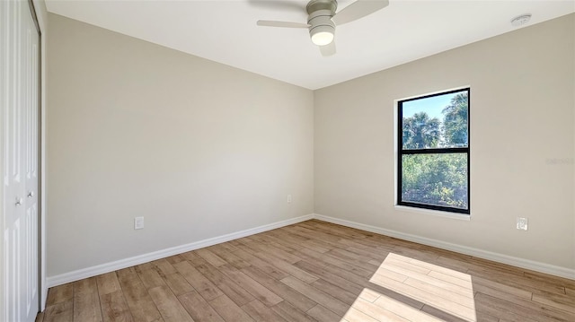 empty room featuring light wood-type flooring and ceiling fan