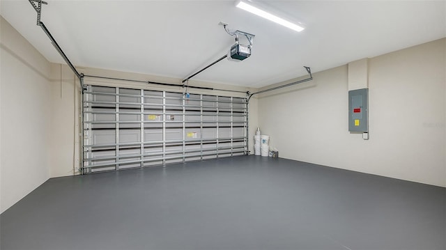 garage with electric panel and a garage door opener