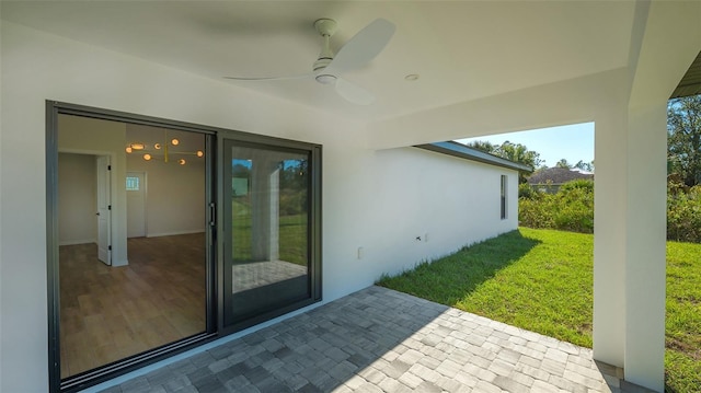 view of patio / terrace featuring ceiling fan