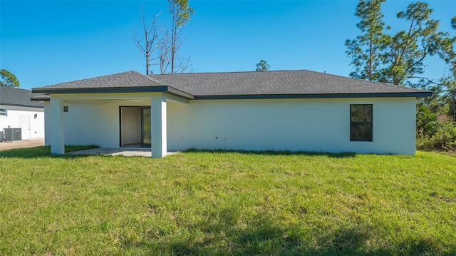 back of house featuring a patio, cooling unit, and a lawn