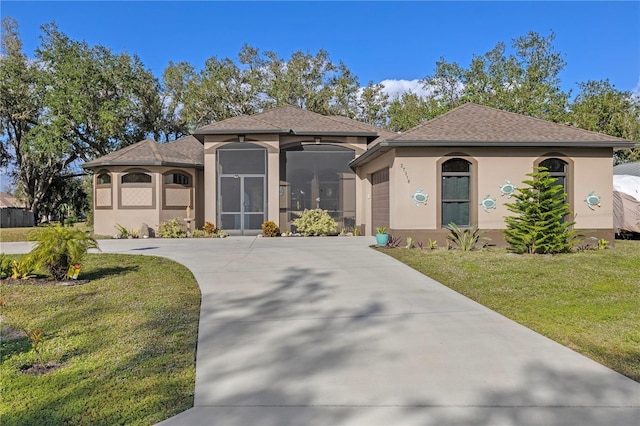 view of front of house with a sunroom and a front yard