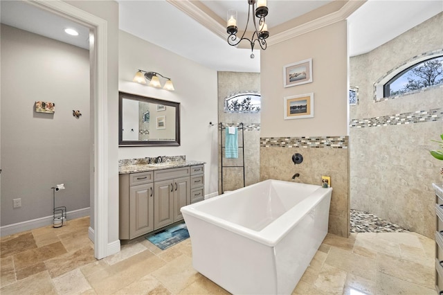 bathroom with vanity, crown molding, tile walls, independent shower and bath, and a chandelier