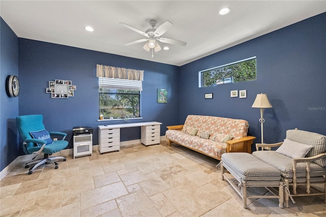 sitting room featuring ceiling fan