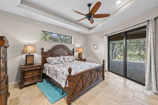 bedroom with a raised ceiling, multiple windows, ceiling fan, and access to outside