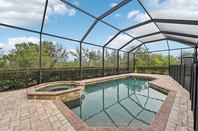 view of swimming pool featuring a patio and glass enclosure