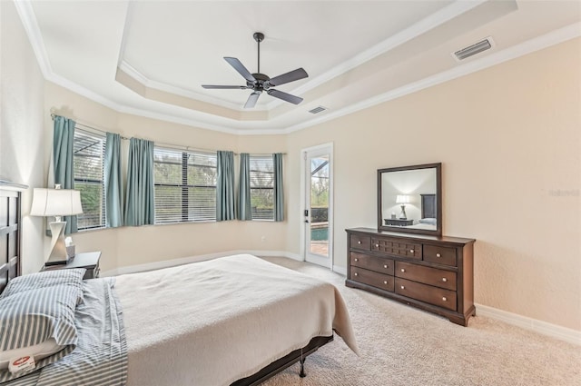 bedroom with light carpet, ornamental molding, access to outside, a tray ceiling, and ceiling fan