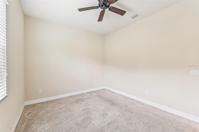 carpeted empty room with ceiling fan