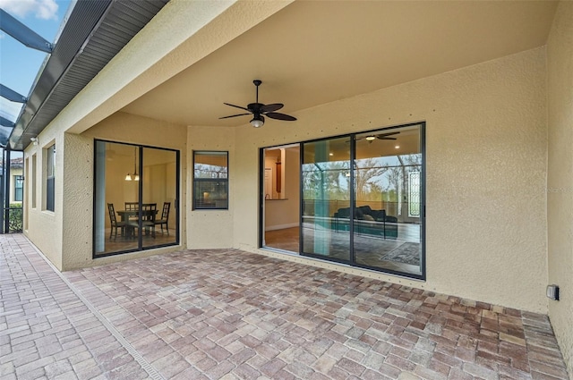 view of patio featuring ceiling fan