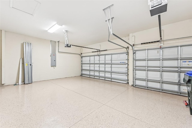 garage with electric panel and a garage door opener