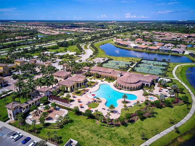 birds eye view of property with a water view