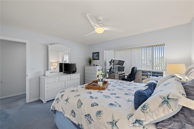 bedroom featuring carpet, a textured ceiling, and ceiling fan