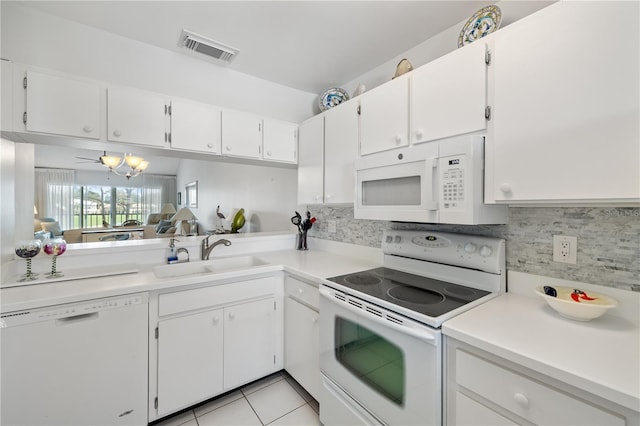 kitchen with white appliances, sink, ceiling fan, light tile patterned flooring, and white cabinetry