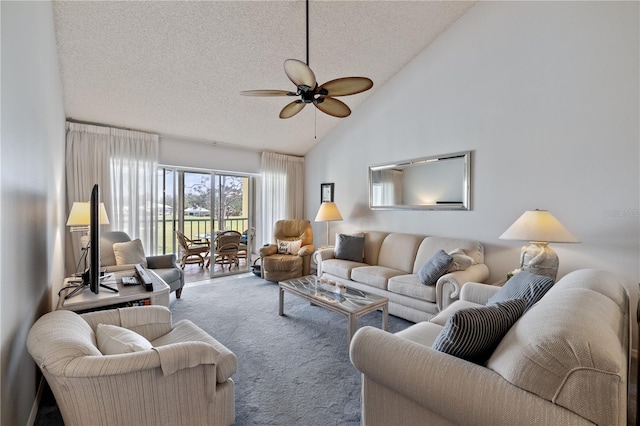 living room with carpet, a textured ceiling, vaulted ceiling, and ceiling fan