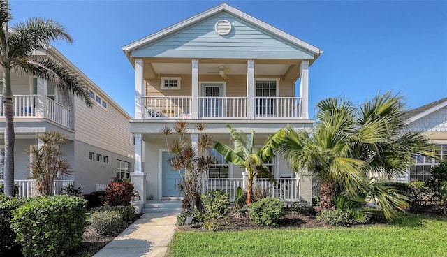 view of front facade with covered porch and a balcony