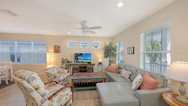 tiled living room featuring ceiling fan