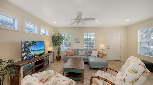 living room with ceiling fan, light tile patterned floors, and plenty of natural light