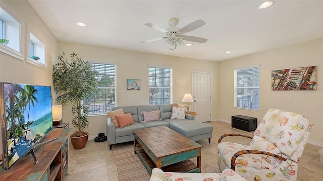 living room featuring ceiling fan and light tile patterned floors