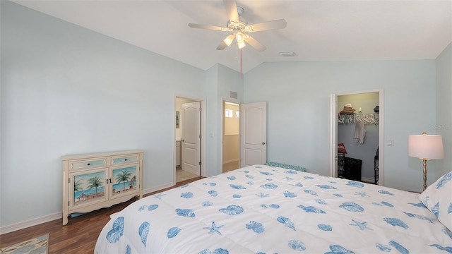 bedroom featuring connected bathroom, a closet, vaulted ceiling, ceiling fan, and a spacious closet