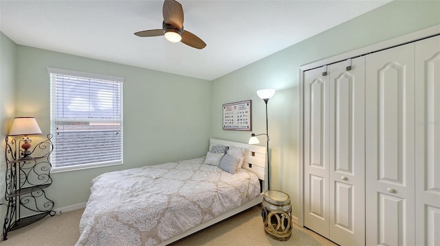 bedroom featuring ceiling fan and light carpet