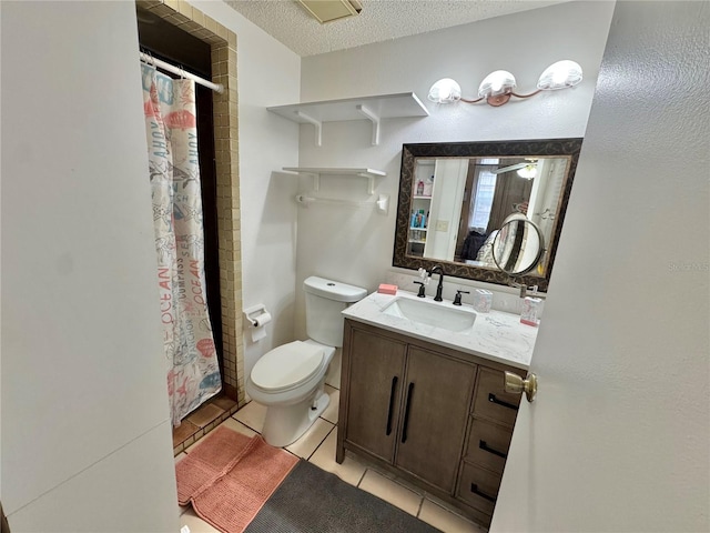 bathroom featuring a shower with curtain, tile patterned flooring, a textured ceiling, toilet, and vanity