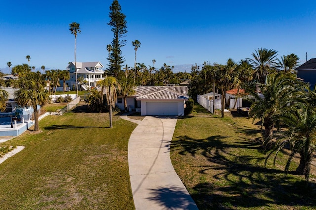 view of front of home featuring a front yard and a garage