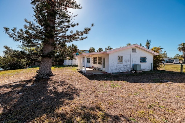 rear view of house with central AC