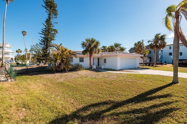 view of front of house featuring a garage and a front yard