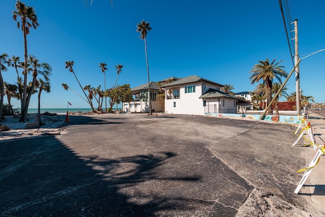back of house with a water view