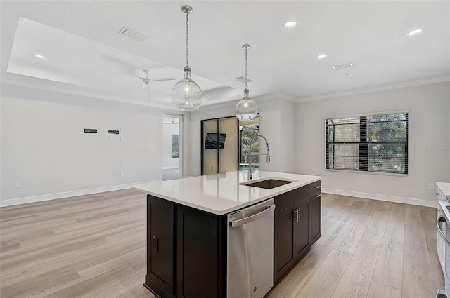 kitchen with ceiling fan, dishwasher, sink, light hardwood / wood-style flooring, and a kitchen island with sink