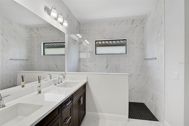 bathroom with vanity and tiled shower