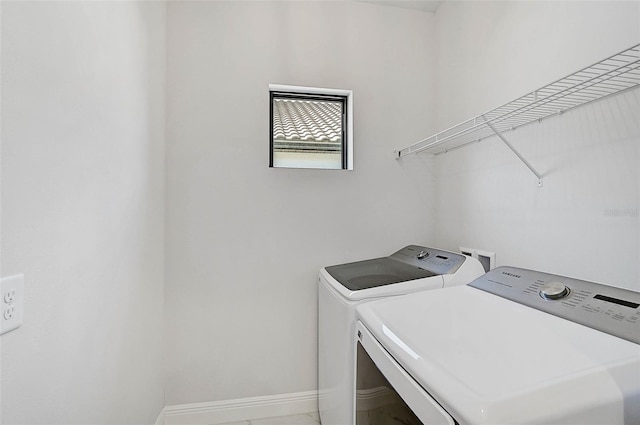 laundry area with washing machine and dryer