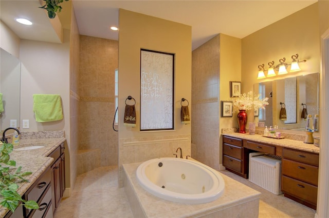 bathroom with tile patterned flooring, vanity, and separate shower and tub