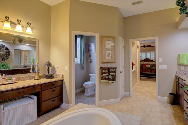 bathroom featuring ceiling fan, tile patterned flooring, vanity, and toilet