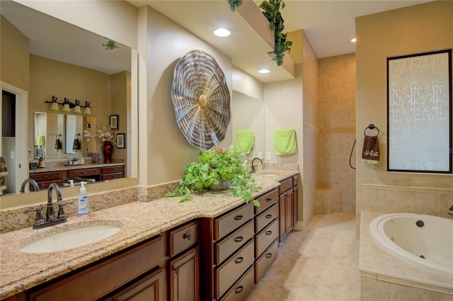 bathroom featuring tile patterned flooring, vanity, and independent shower and bath