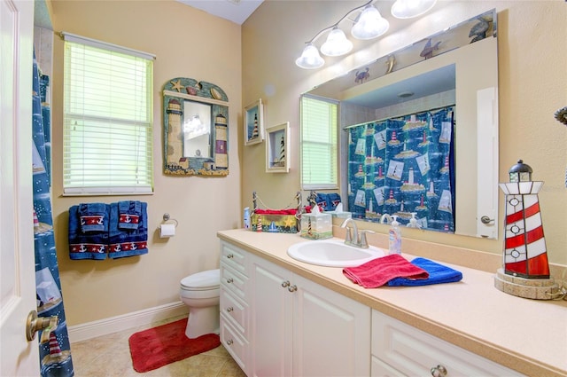 bathroom featuring tile patterned flooring, toilet, and a healthy amount of sunlight