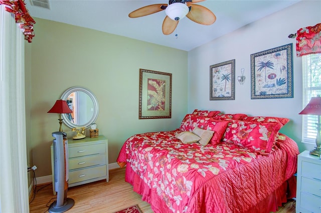 bedroom featuring ceiling fan and light hardwood / wood-style flooring