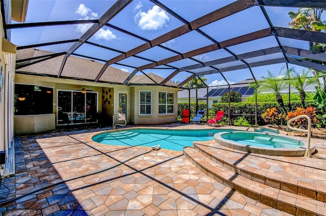 view of pool with ceiling fan, a lanai, an in ground hot tub, and a patio