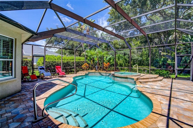 view of swimming pool featuring an in ground hot tub, a patio, and a lanai