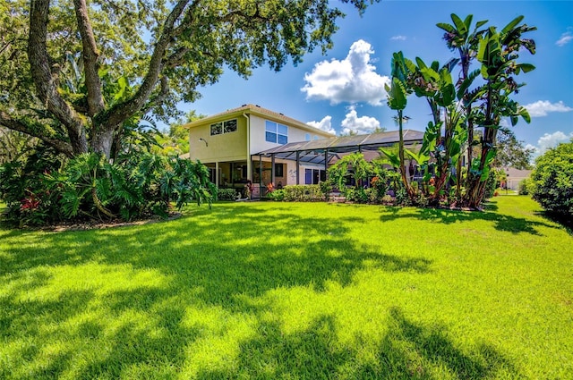 view of yard featuring a lanai