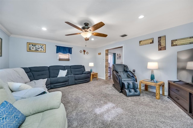 carpeted living room featuring ceiling fan and ornamental molding