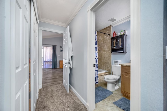 full bathroom featuring vanity, tile patterned flooring, toilet, shower / bathtub combination with curtain, and ornamental molding