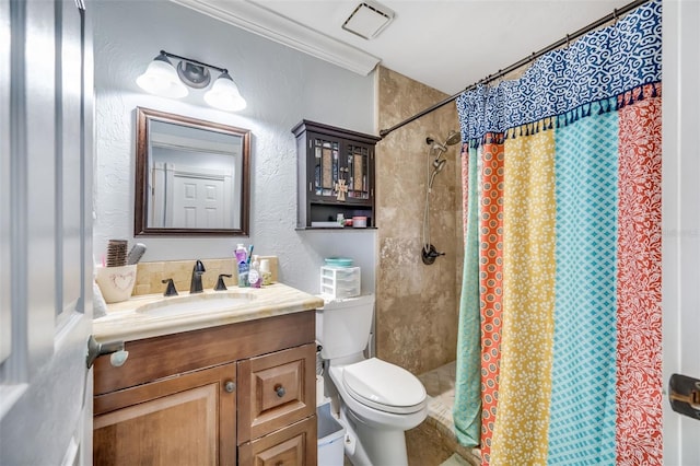 bathroom with a shower with curtain, vanity, toilet, and crown molding