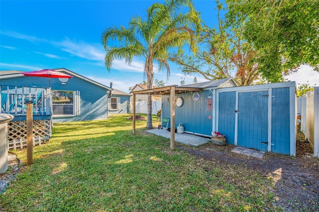 view of yard featuring a shed and a deck